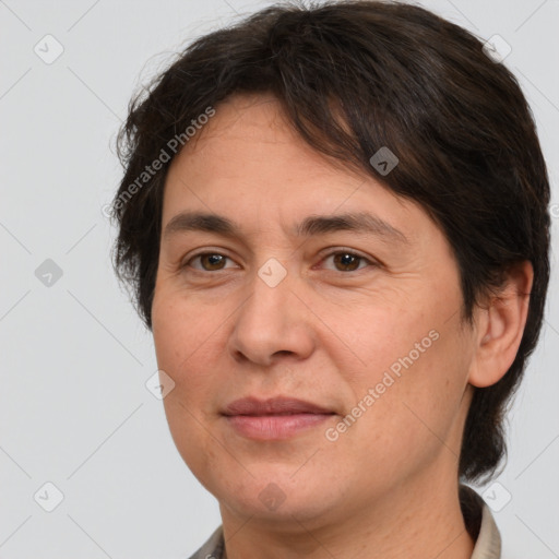 Joyful white adult female with short  brown hair and brown eyes