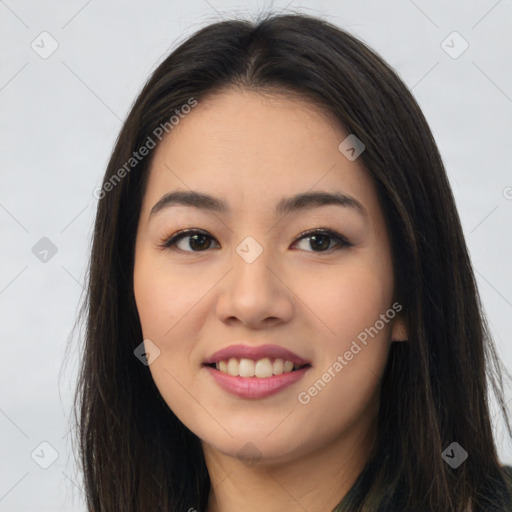 Joyful asian young-adult female with long  brown hair and brown eyes