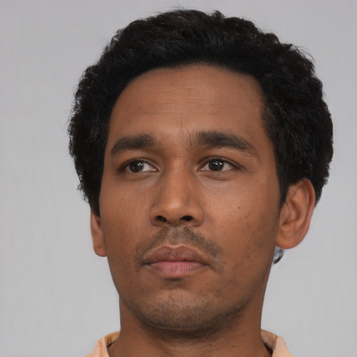 Neutral black young-adult male with short  black hair and brown eyes