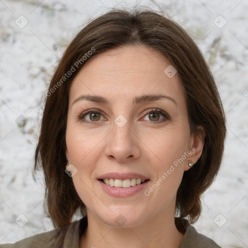 Joyful white young-adult female with medium  brown hair and green eyes