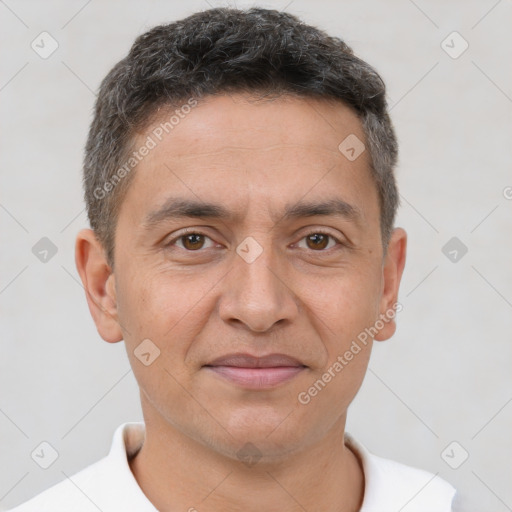 Joyful white adult male with short  brown hair and brown eyes
