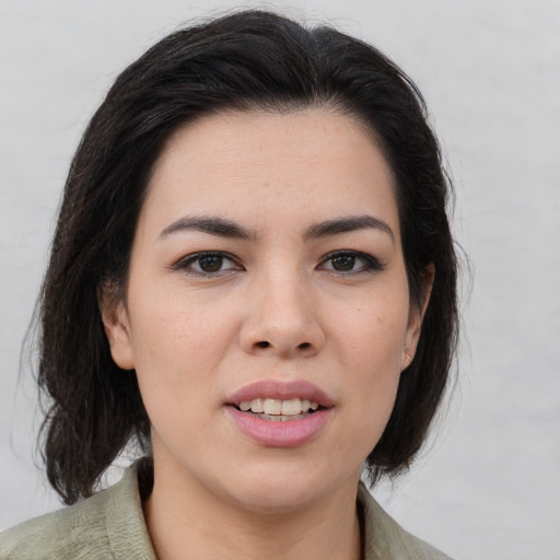 Joyful asian young-adult female with medium  brown hair and brown eyes