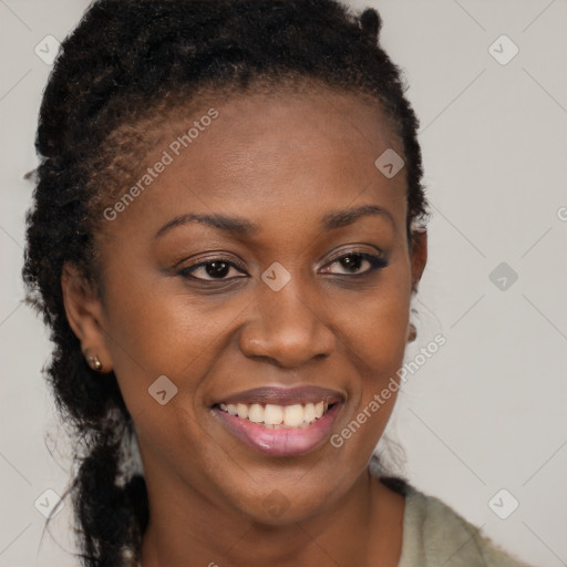 Joyful black young-adult female with long  brown hair and brown eyes