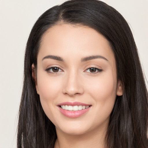 Joyful white young-adult female with long  black hair and brown eyes