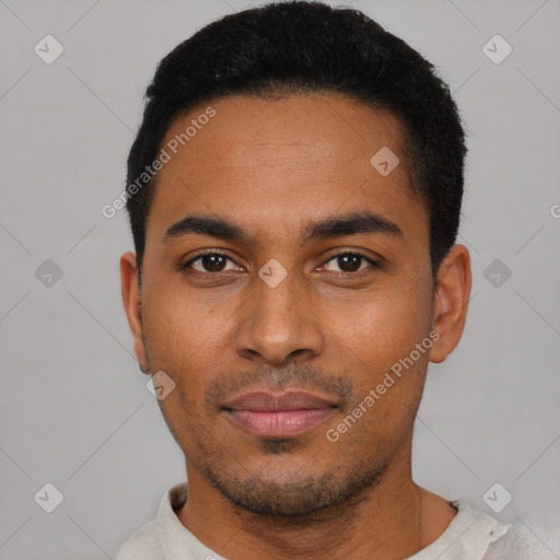 Joyful latino young-adult male with short  black hair and brown eyes