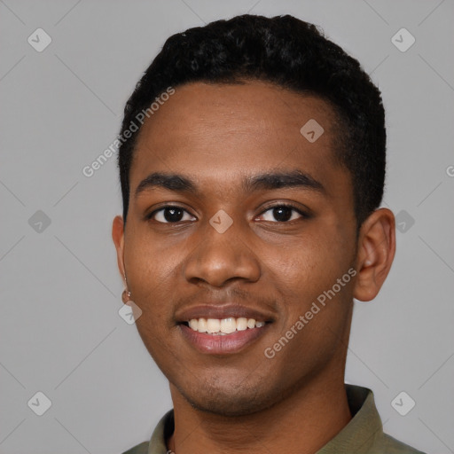 Joyful black young-adult male with short  black hair and brown eyes