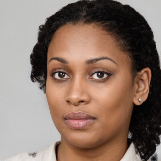 Neutral black young-adult female with medium  black hair and brown eyes