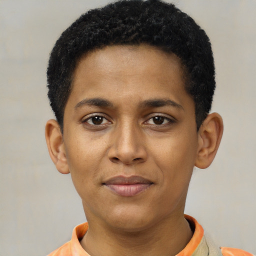 Joyful black young-adult male with short  black hair and brown eyes