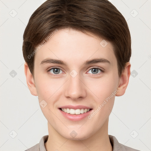 Joyful white young-adult female with short  brown hair and grey eyes