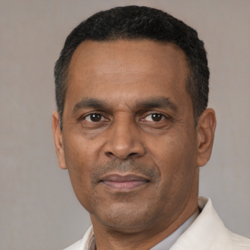 Neutral latino adult male with short  black hair and brown eyes