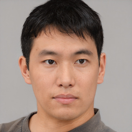 Neutral asian young-adult male with short  black hair and brown eyes