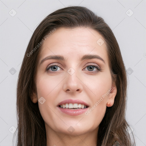 Joyful white young-adult female with long  brown hair and grey eyes