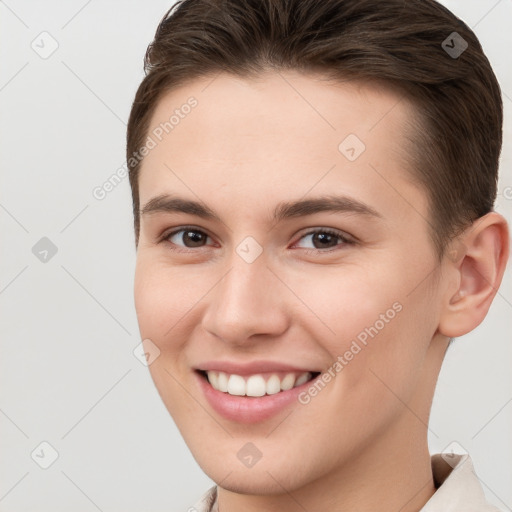 Joyful white young-adult female with short  brown hair and brown eyes