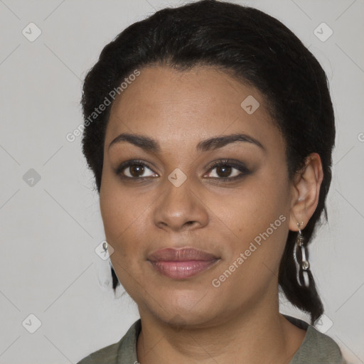 Joyful black young-adult female with medium  black hair and brown eyes