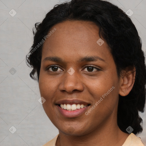 Joyful black young-adult female with short  black hair and brown eyes