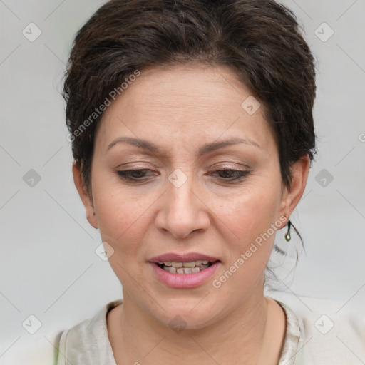 Joyful white adult female with short  brown hair and brown eyes