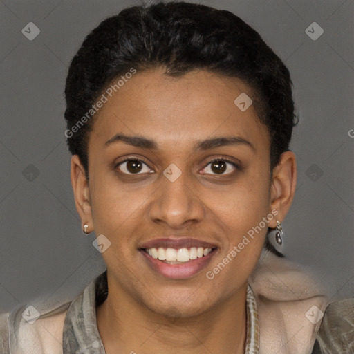 Joyful black young-adult female with short  brown hair and brown eyes