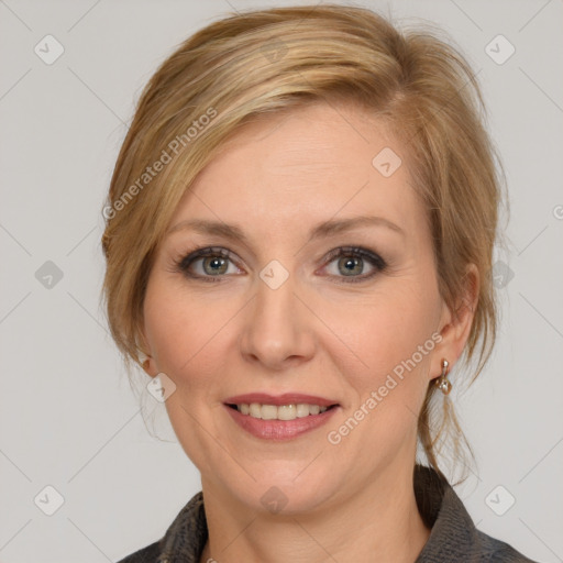 Joyful white adult female with medium  brown hair and blue eyes