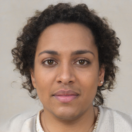 Neutral black young-adult female with short  brown hair and brown eyes