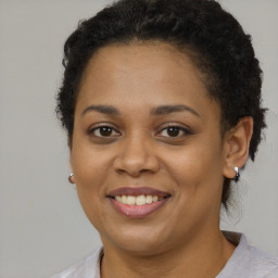 Joyful latino young-adult female with short  brown hair and brown eyes