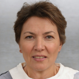 Joyful white adult female with short  brown hair and brown eyes