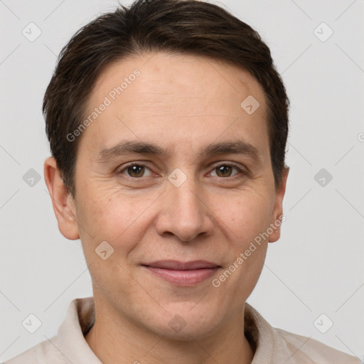 Joyful white adult male with short  brown hair and brown eyes