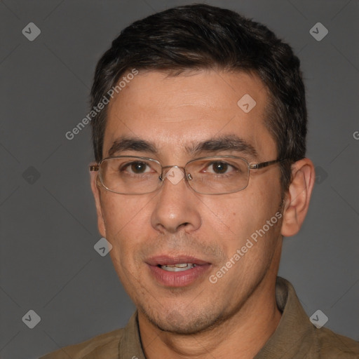 Joyful white adult male with short  black hair and brown eyes