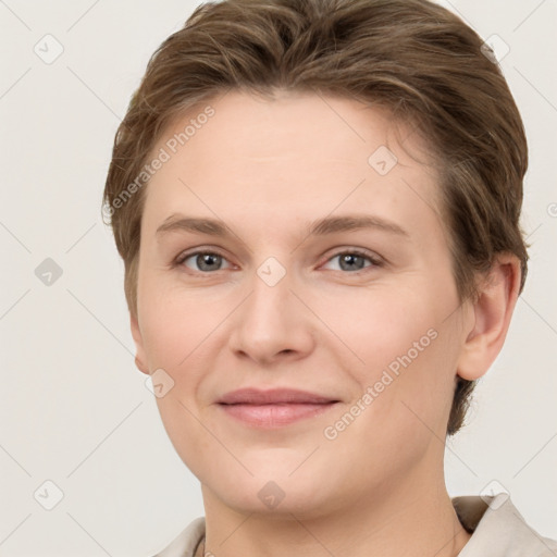 Joyful white young-adult female with short  brown hair and grey eyes