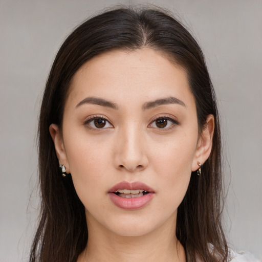 Neutral white young-adult female with long  brown hair and brown eyes