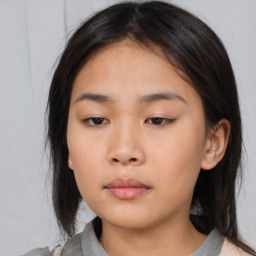 Neutral asian young-adult female with medium  brown hair and brown eyes