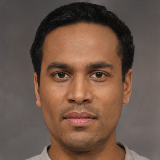 Neutral latino young-adult male with short  black hair and brown eyes