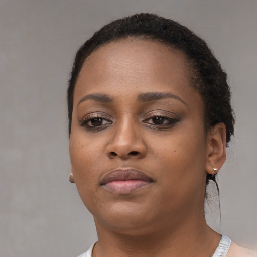 Neutral black young-adult female with short  brown hair and brown eyes