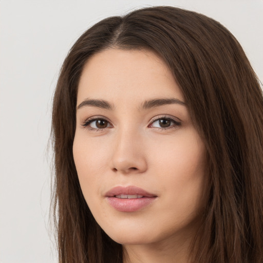 Neutral white young-adult female with long  brown hair and brown eyes