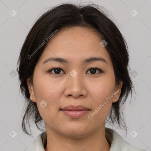 Joyful asian young-adult female with medium  brown hair and brown eyes