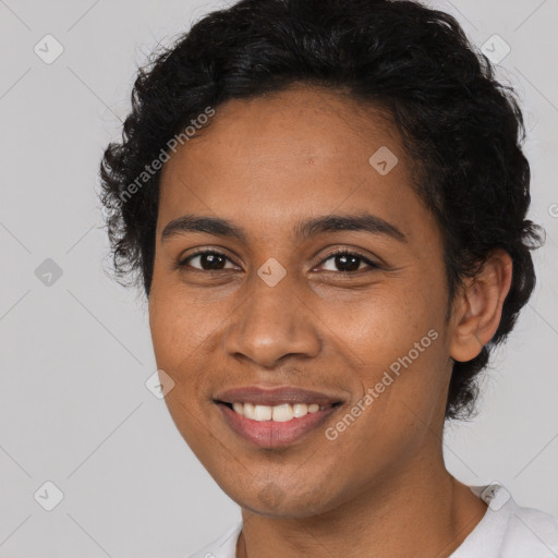 Joyful black young-adult female with short  brown hair and brown eyes