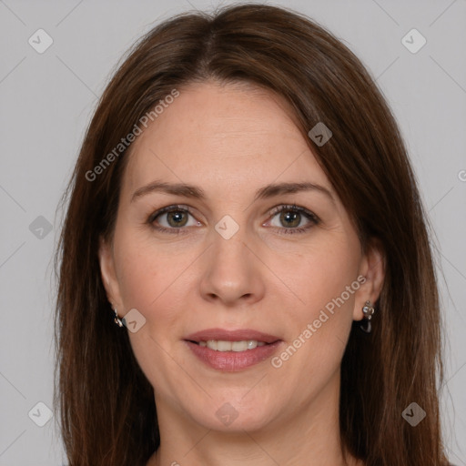 Joyful white adult female with long  brown hair and brown eyes