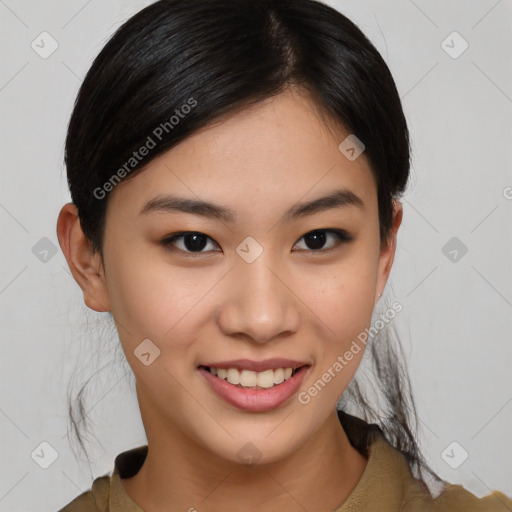 Joyful asian young-adult female with medium  brown hair and brown eyes