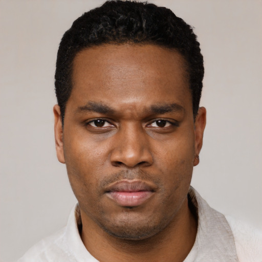 Neutral black young-adult male with short  black hair and brown eyes