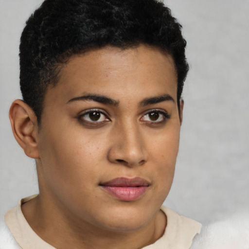 Joyful latino young-adult female with short  brown hair and brown eyes