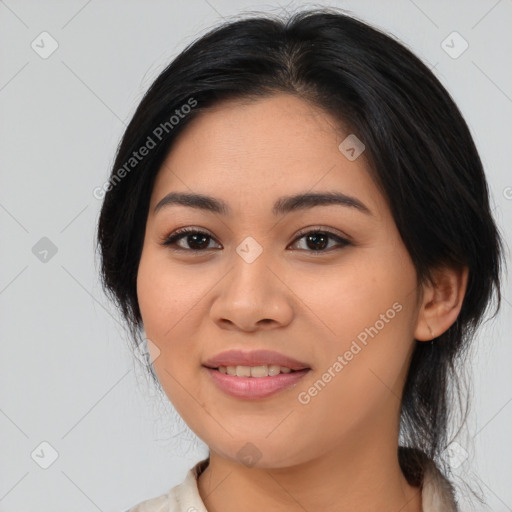 Joyful asian young-adult female with medium  black hair and brown eyes