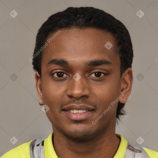 Joyful black young-adult male with short  black hair and brown eyes