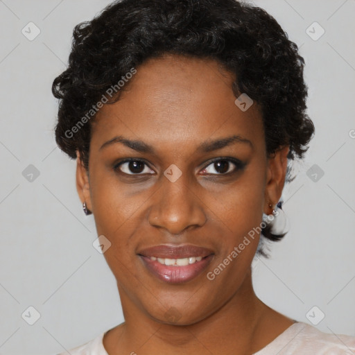 Joyful black young-adult female with short  black hair and brown eyes