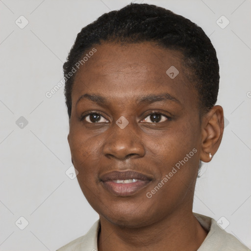 Joyful black young-adult female with short  black hair and brown eyes