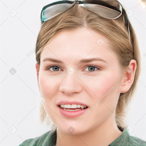 Joyful white young-adult female with medium  brown hair and blue eyes