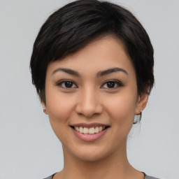 Joyful asian young-adult female with short  black hair and brown eyes