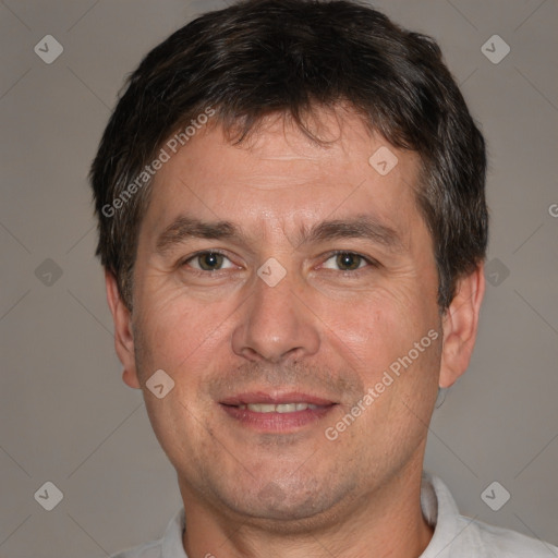 Joyful white adult male with short  brown hair and brown eyes