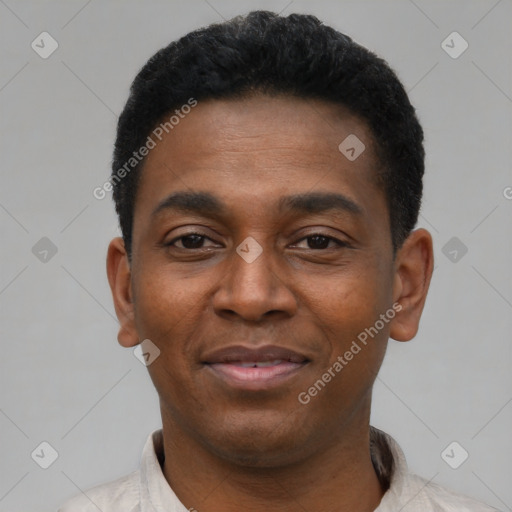 Joyful black young-adult male with short  black hair and brown eyes