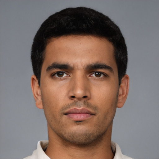 Neutral latino young-adult male with short  brown hair and brown eyes