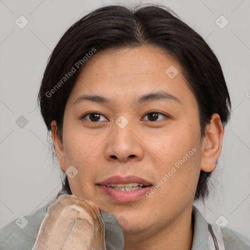 Joyful asian young-adult female with medium  brown hair and brown eyes