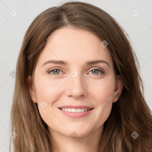 Joyful white young-adult female with long  brown hair and green eyes